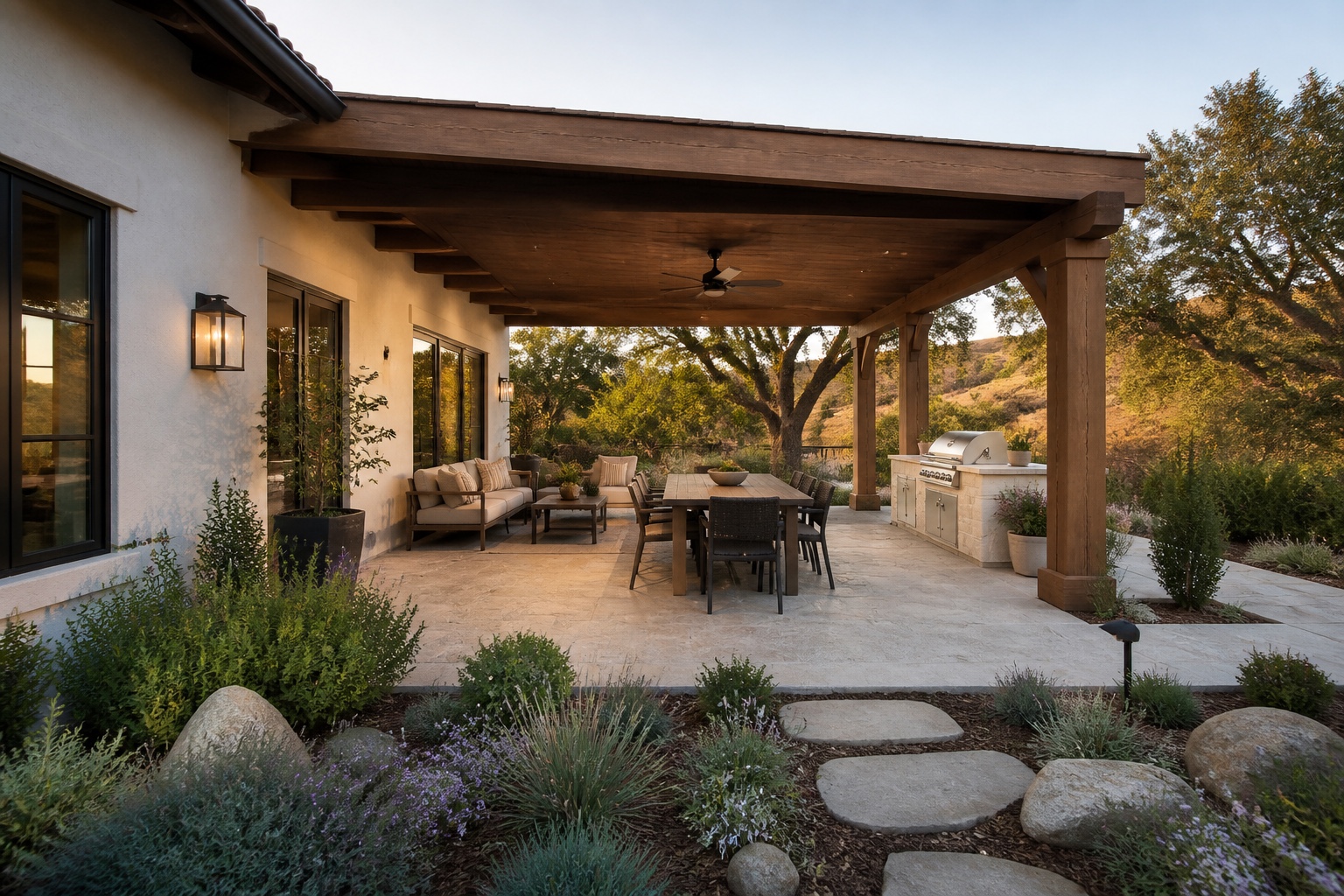 Complete covered patio concept with dining, seating, outdoor kitchen, and oak-tree view